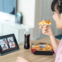 team-lunch-video-call-pizza-young-woman.jpg